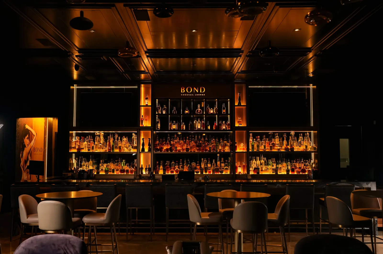Bond Cocktail Lounge's backlit bar and lounge seating on Auburn Ave, McAllen