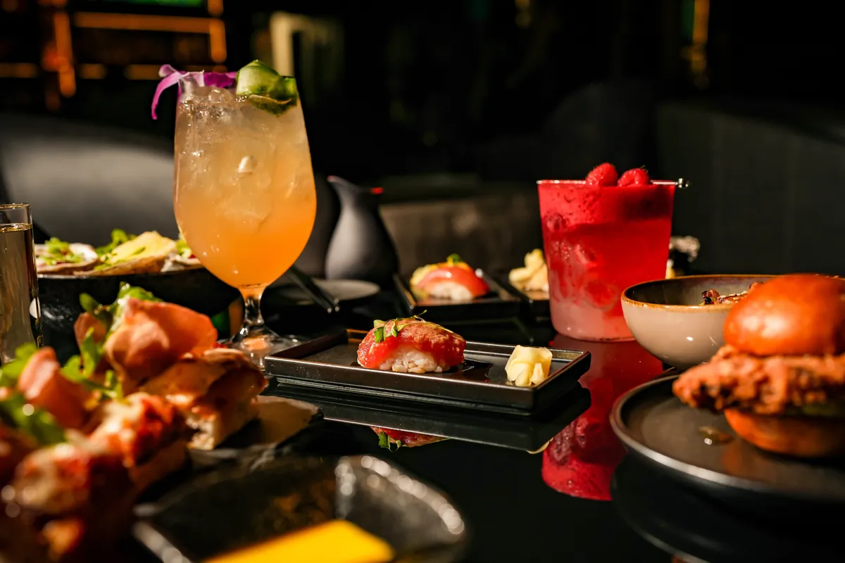 Signature cocktails alongside wagyu sliders and small plates