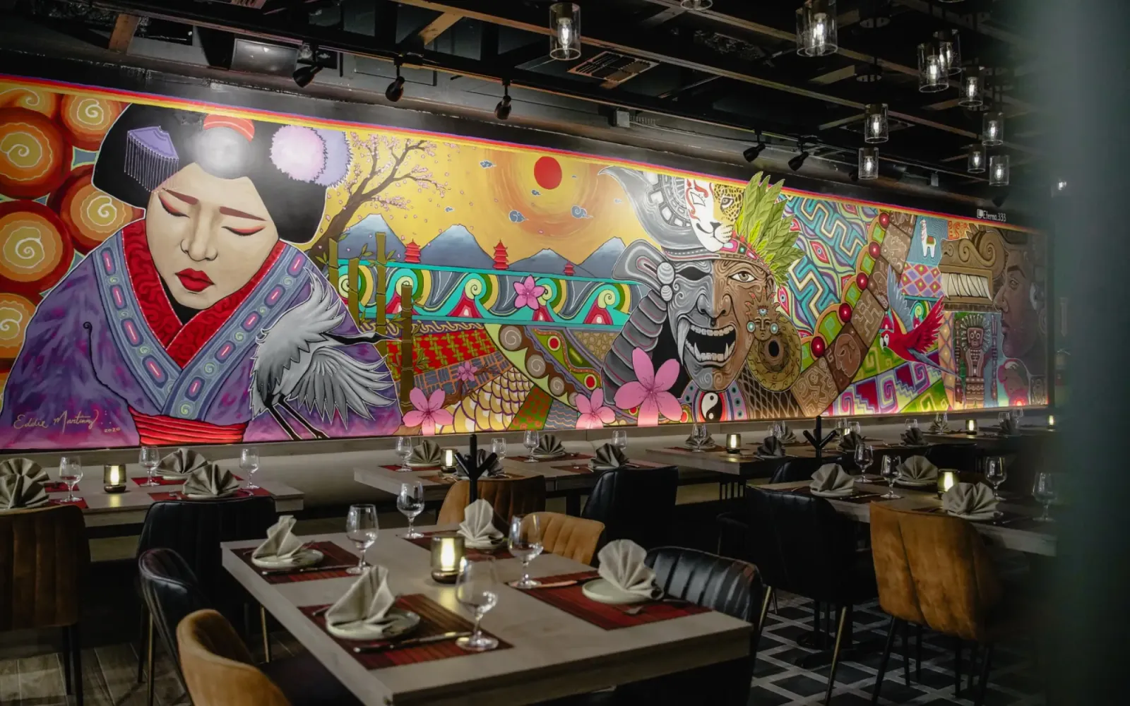 Mikhuna's dining room on North Main Street beneath its geisha-and-Andes mural, McAllen