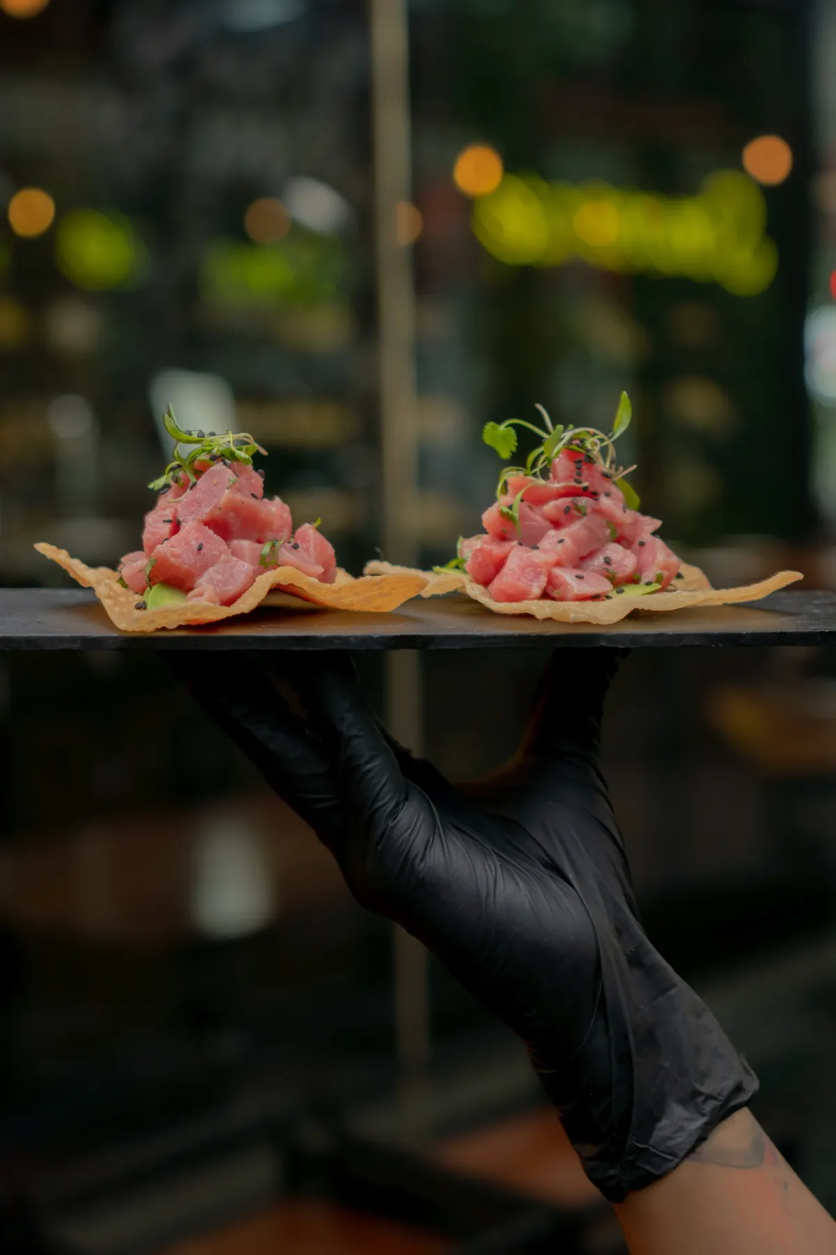 Tuna tostadas topped with microgreens