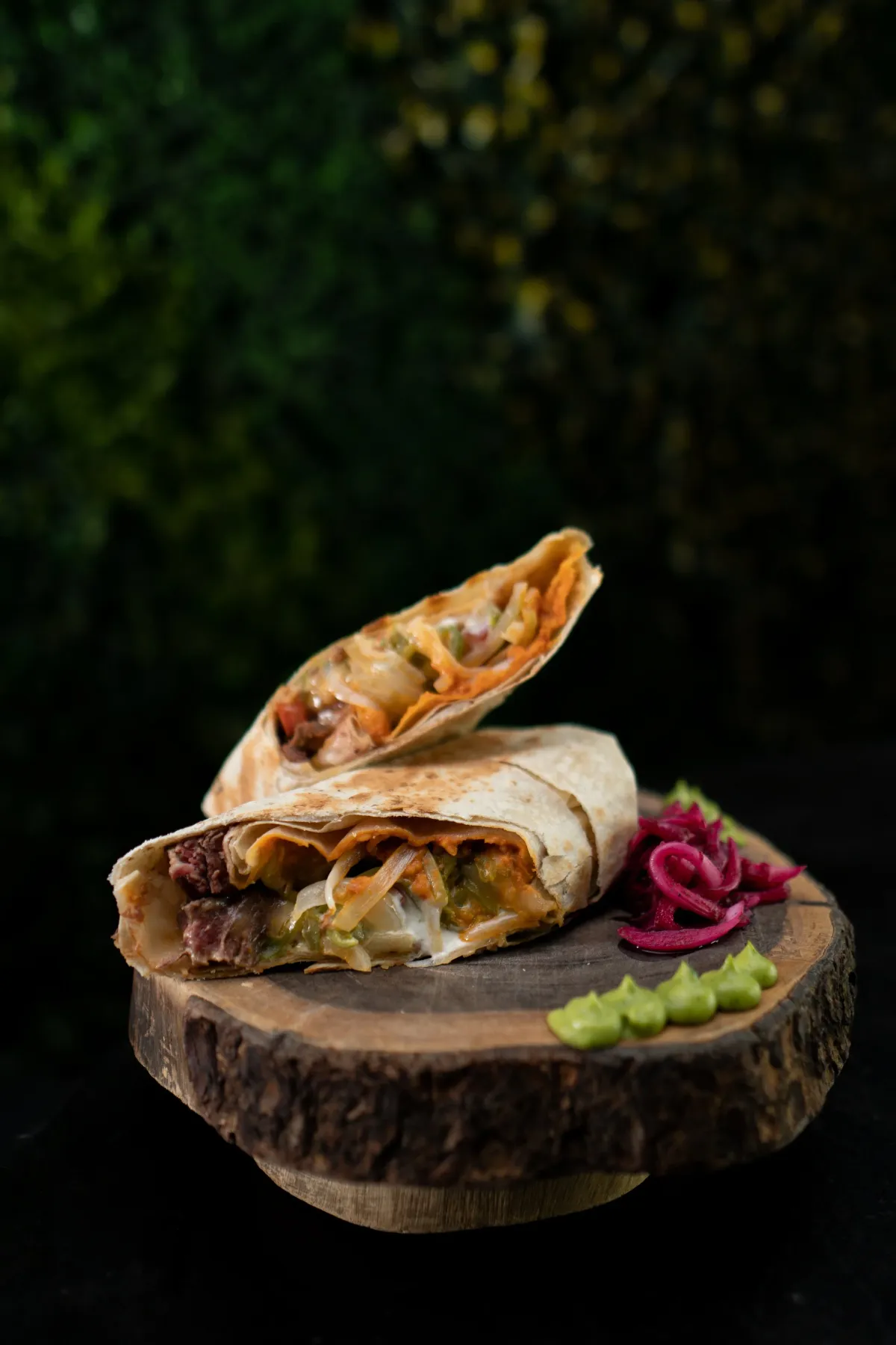 Grilled carne asada burrito with pickled onion