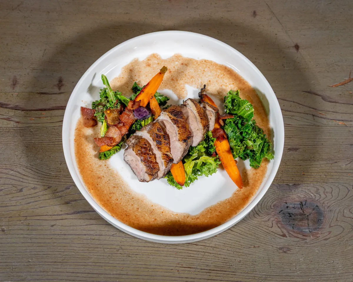 Magret de canard, sliced duck breast with roasted carrots