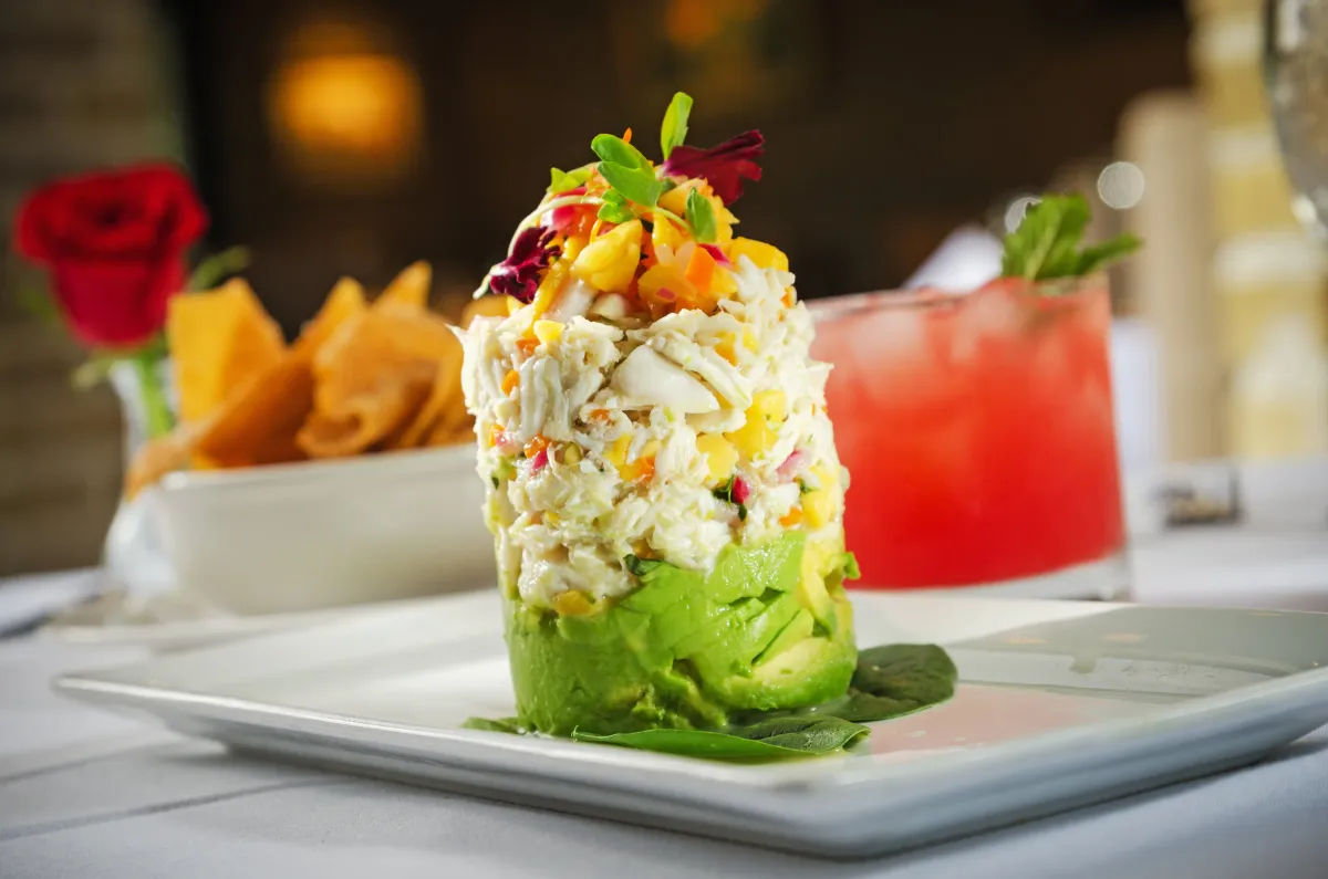 Crab meat tower stacked with mango and avocado