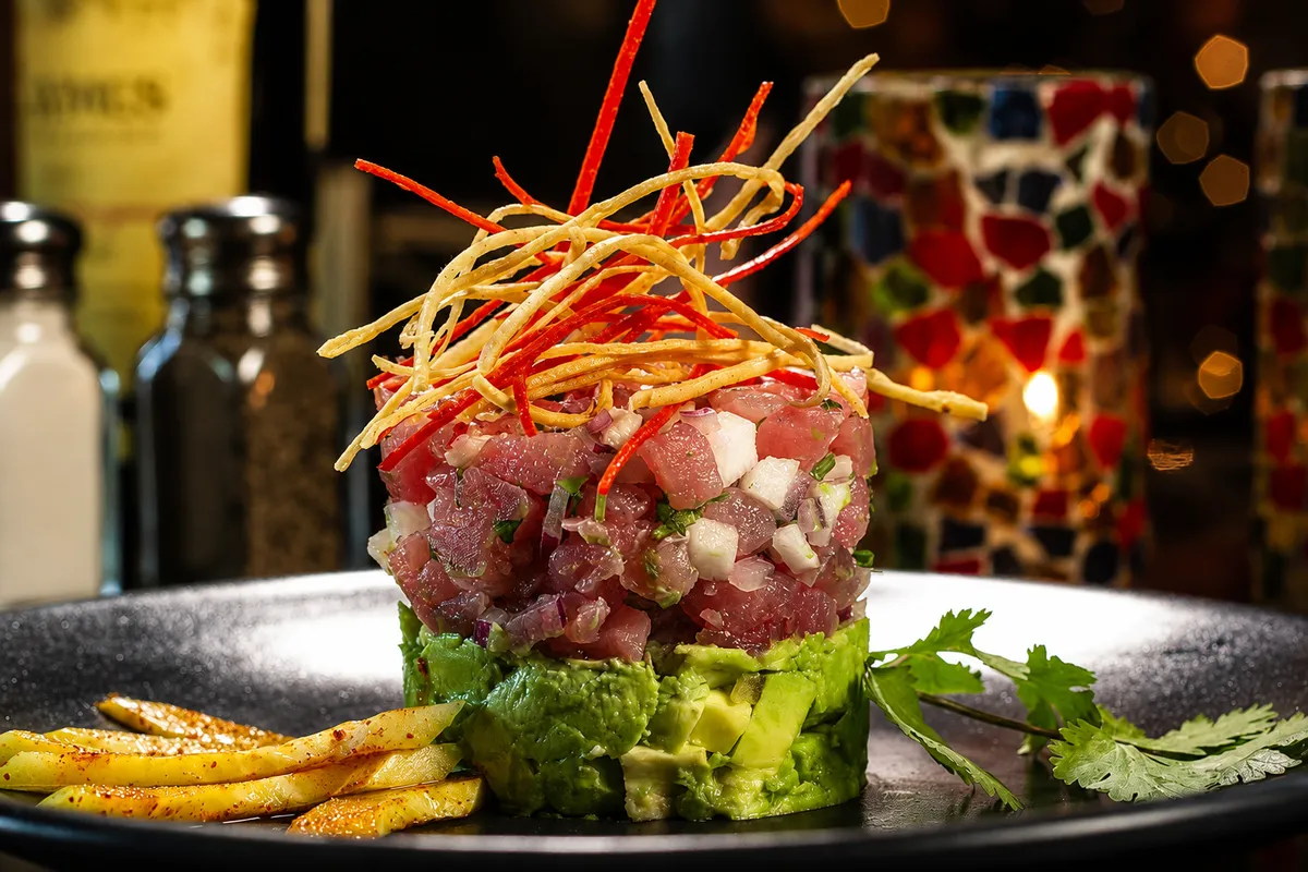 Ahi tuna ceviche tower with avocado and crispy tortilla strips